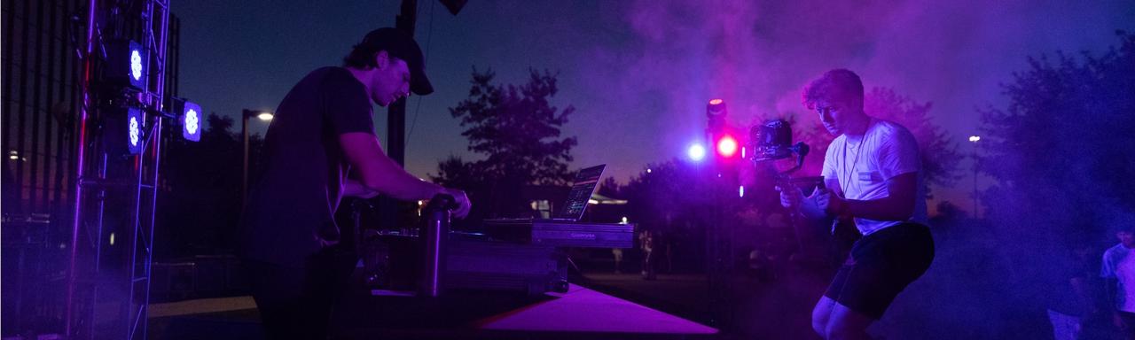 A student films the DJ at Silent Disco